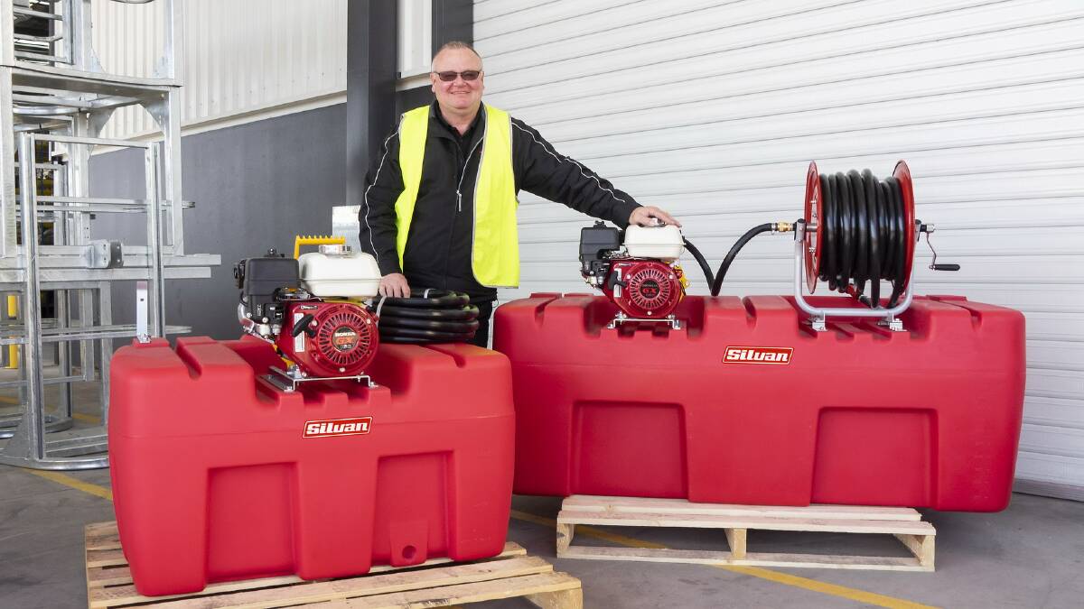 ON FIRE: Silvan Selecta warehouse manager Greg Everett with the Silvan 400 and 800 litre Polytuff tank and engine, pump set and delivery hoses. 