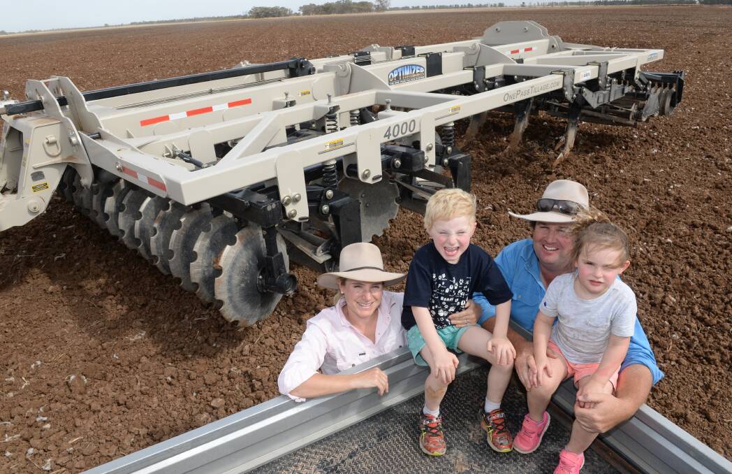 Darlington Point, NSW cotton grower, Mat Stott, wife Hannah and children Henry and Emily with their new US built Optimizer deep tillage machine that he expects will reduce the number of passes required preparing crop rotations.