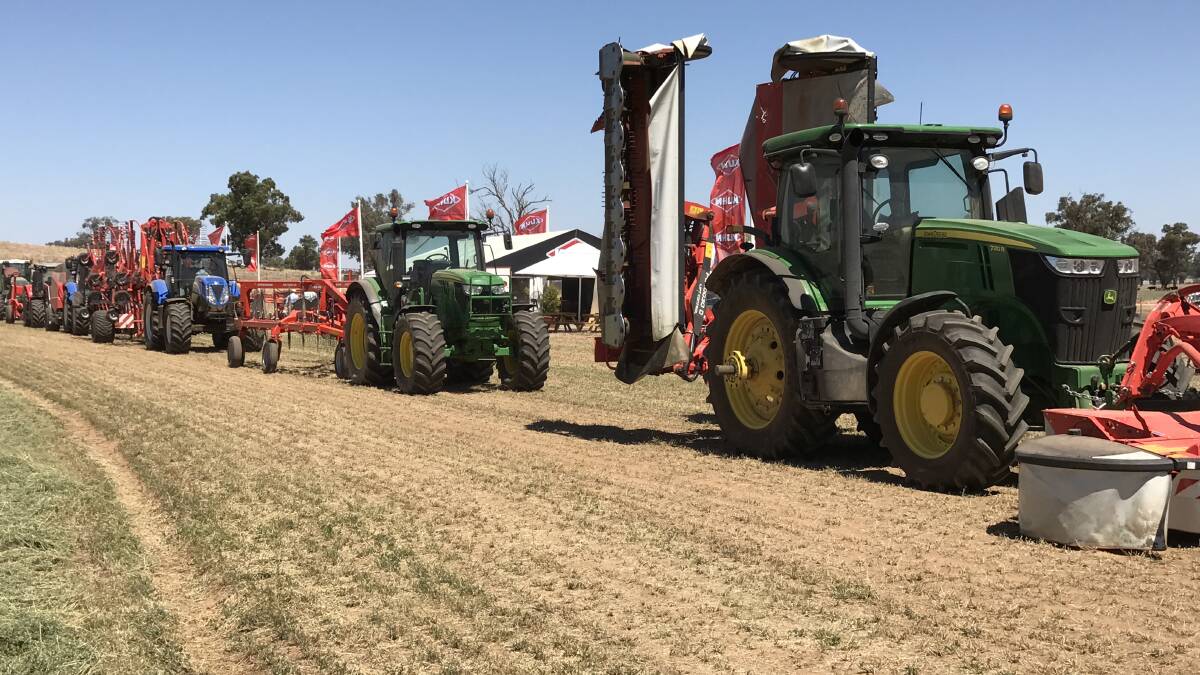 A line-up of Kuhn hay equipment ready for demonstration.