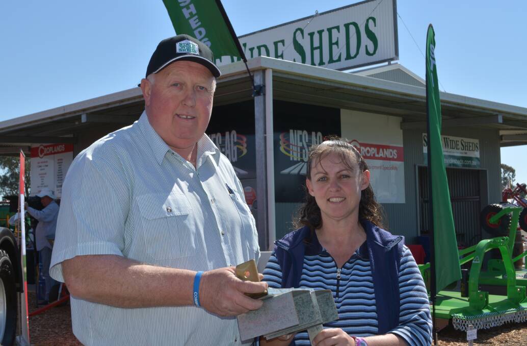 State Wide Sheds operations manager, Michael Dodd, discusses the company’s  construction features with Boggabri visitor to last week's AgQuip field days in North West NSW, Gail Crowley.