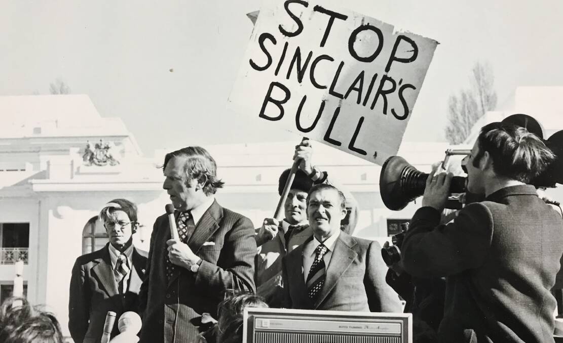 Market beef: Primary Industry Minister in the Fraser Government, Ian Sinclair addresses an unhappy beef producer rally outside old Parliament House in the 1970s flanked by NSW Livestock and Grain Producers Association president Milton Taylor and meat and livestock committee chairman Ken Leckie.