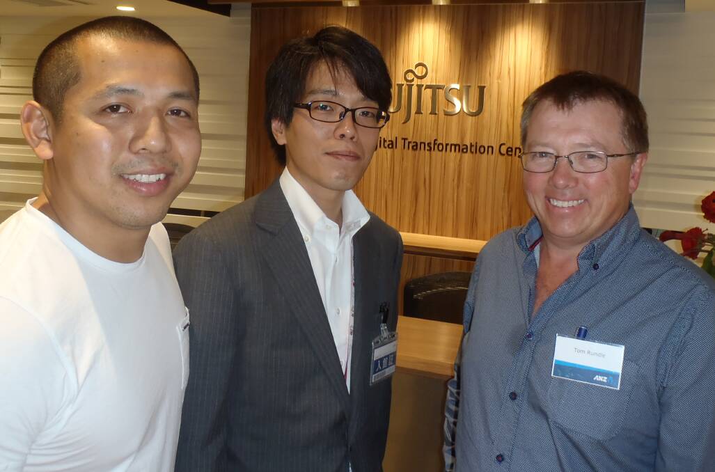 Produce merchant and Comfresh principal Johnny Tran, Adelaide, and South Australian regional banking executive with ANZ, Tom Rundle, talk with Fujitsu's Kazutaka Nakamura, during the bank's recent agricultural technology tour in Asia.