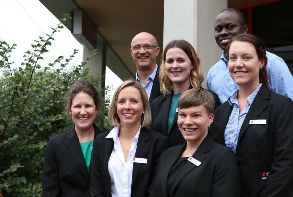 Victoria-Tasmania head of agribusiness, Roger Gaudion, with former Zimbabwean Tich Pfumayaramba and fellow agribusiness recruits, Dominique Brown, Kate Fitzpatrick and (front) Stephanie Thompson, Annabel Wallace and Jemma McDougall.
 
