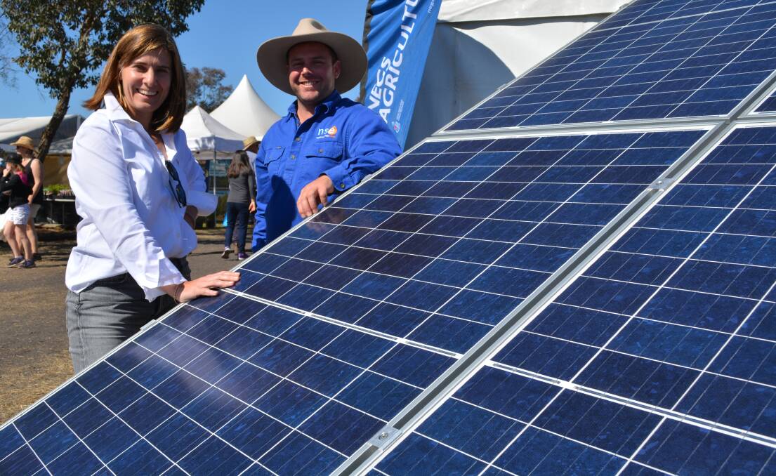 Commonwealth Bank of Australia’s NSW regional and agribusiness banking general Margot Faraci talks electricity efficiency ideas with Namoi Sustainable Energy principal, Will Lulhan, Tamworth at the recent AgQuip field days.