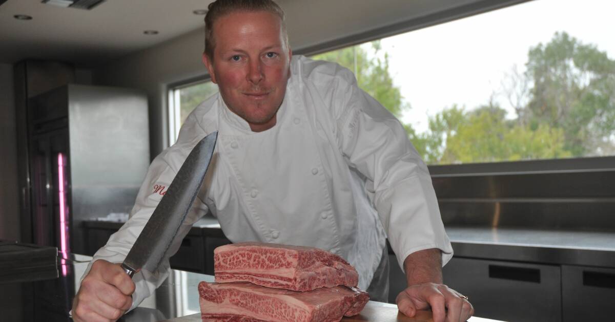 UNIQUE EXPERIENCE: The Tasting Room's head chef Mark Wright prepares some of Mayura Station full-blood Wagyu short ribs at the on-farm restaurant.