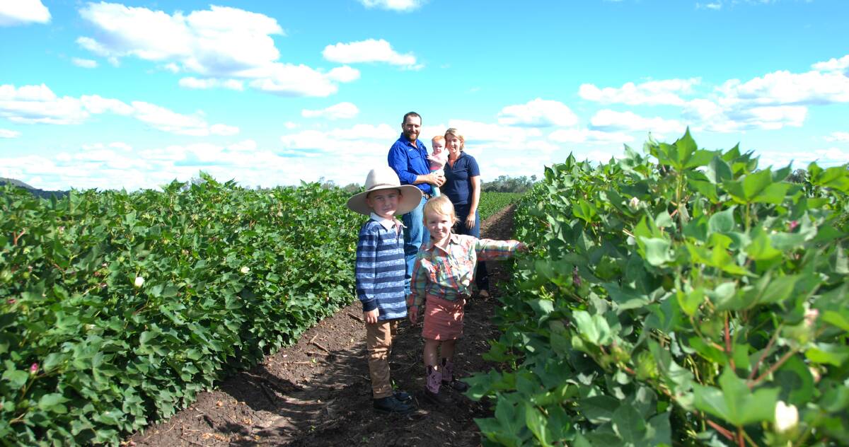 Rohan and Suzie Hindle with their children in the family's irrigated Bollgard 3 cotton crop.