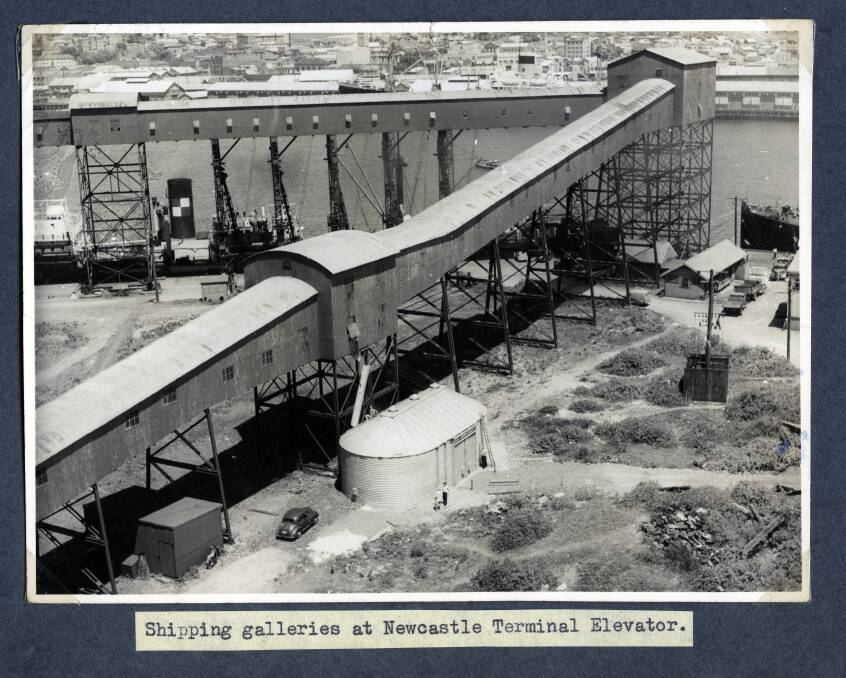 Much has changed in bulk handling since this photo of the port of Newcastle was taken, but the fundamentals of a loading a ship remain the same. 