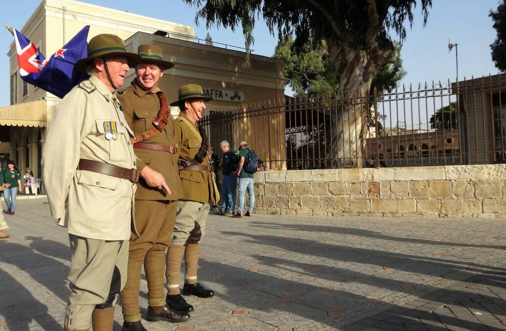 Paying tribute: New Zealanders Chris Holden, centre, flanked by Timothy and Donald Moore, representing their country's mounted infantry at the ceremony at Jaffa. Picture: Sally Cripps.