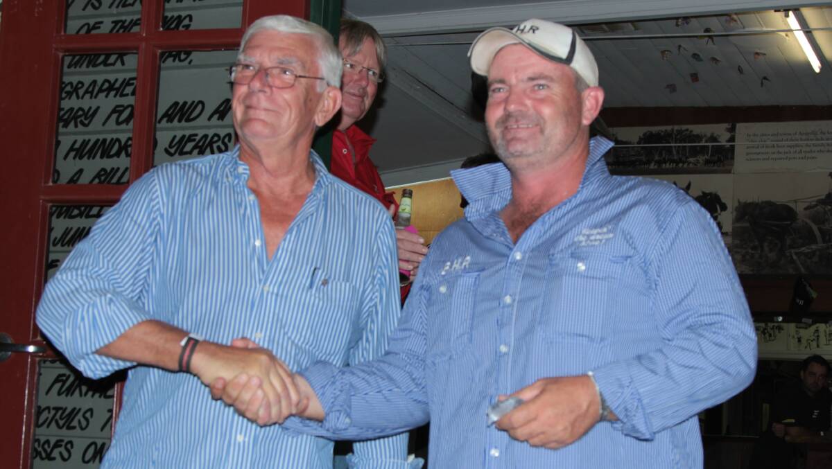 Honoured: Rotary Club of Sydney president Alex Shaw presenting Burrumbuttock Hay Runners founder Brendan Farrell with a sapphire pin for his Paul Harris Fellowship. Picture: Sally Cripps.