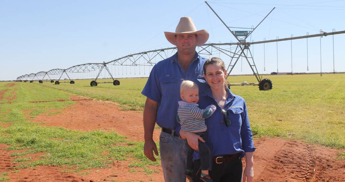 John and Angela Frith and Charlie Jr and the 500m centre pivot they are using to irrigate 90 hectares for hay production, tapping into a local aquifer.