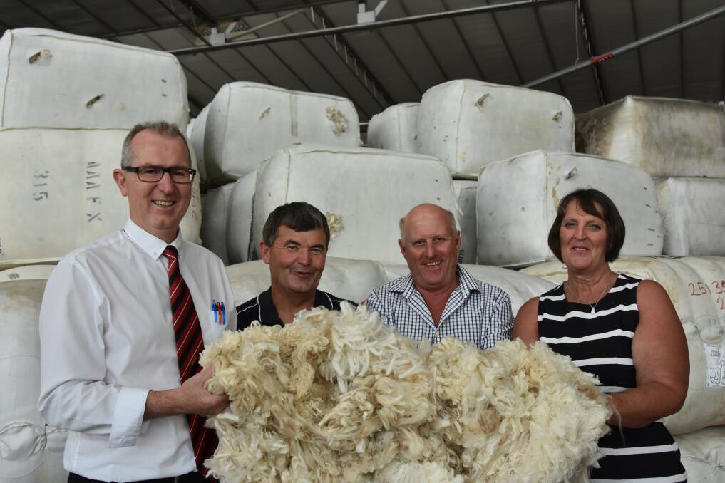 Elders national wool selling manager Simon Hogan, Techwool Trading wool manager Ken Welsh with Russell and Suzanne Nield, Benilkie Station, Balranald at the Melbourne wool auctions. 