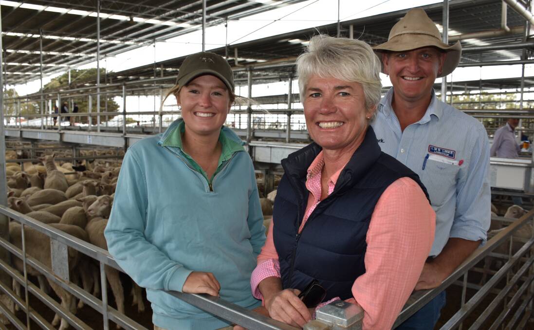 Lucy and Bronnie Fenton, "Vasey Farms", Vasey, with LMB Linke Livestock agent Bernie Grant, and some of the 650 July 2016 drop lambs they sold.
