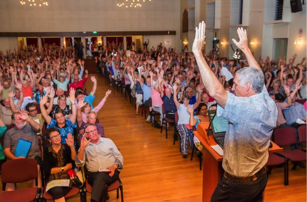 Above- John Dalton asks for a show of 900 hands at a town hall KCCG meeting against the proposed Kingaroy coal mine  (1)
