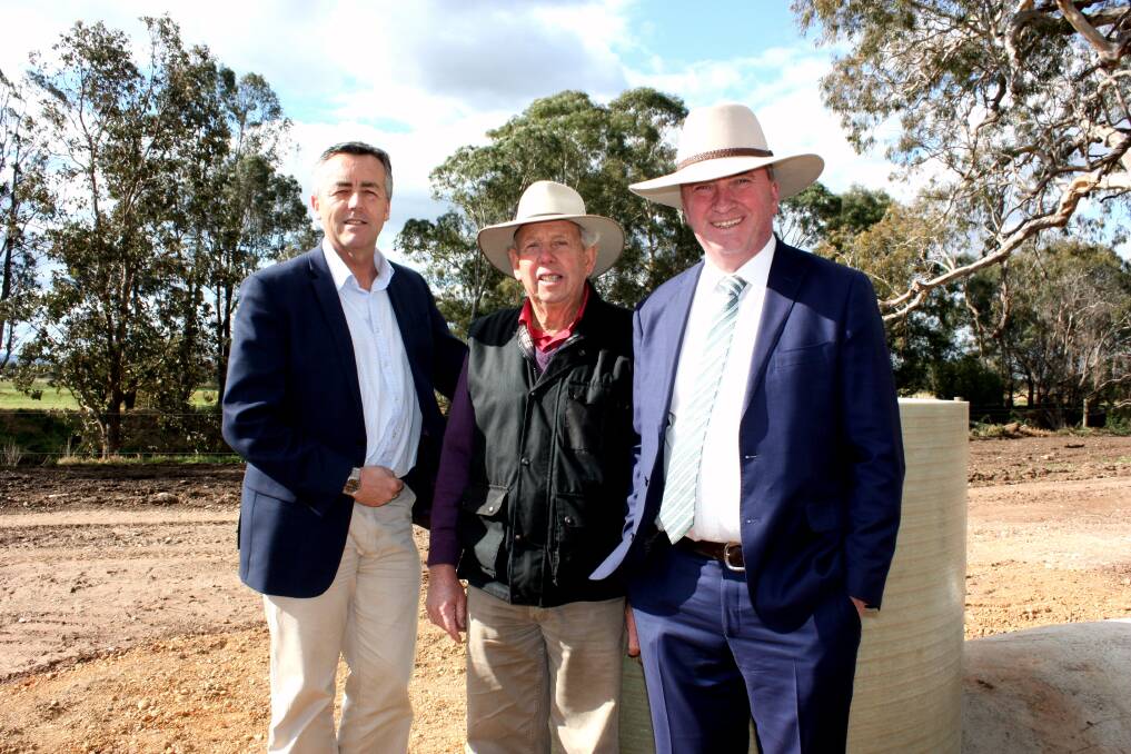 Nationals Gippsland MP Darren Chester (left) with local farmer Alan Clyne and Deputy Prime Minister and Agriculture and Water Resources Minister Barnaby Joyce on site at Tinamba.