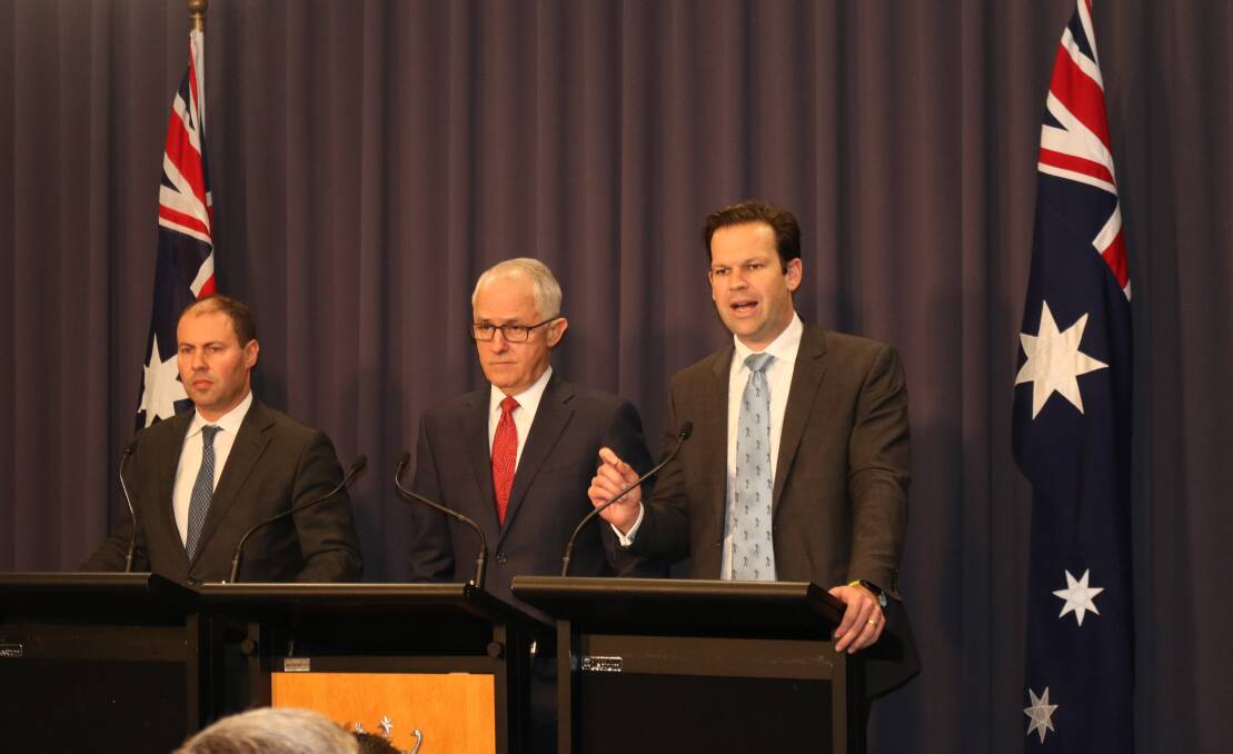 Environment and Energy Minister Josh Frydenberg (left), Prime Minister Malcolm Turnbull and Resources and Northern Australia Minister Matt Canavan at yesterday's announcement in Canberra of a new energy policy push by the government.