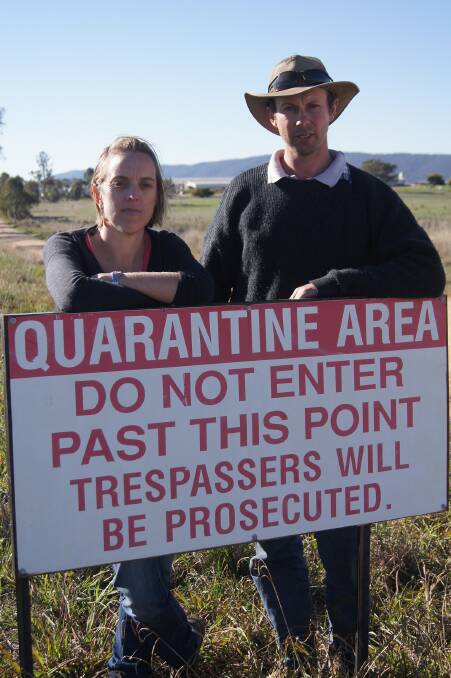Edwina and Michael Beveridge with the type of on-farm signage recommended out of the industry roundtable held in August last year to help address on-farm trespass by animal rights activists.