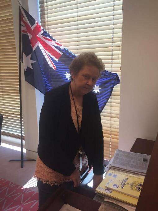 Not happy - Margaret Menzel packing up Rod Culleton's Canberra office on Australia Day.
