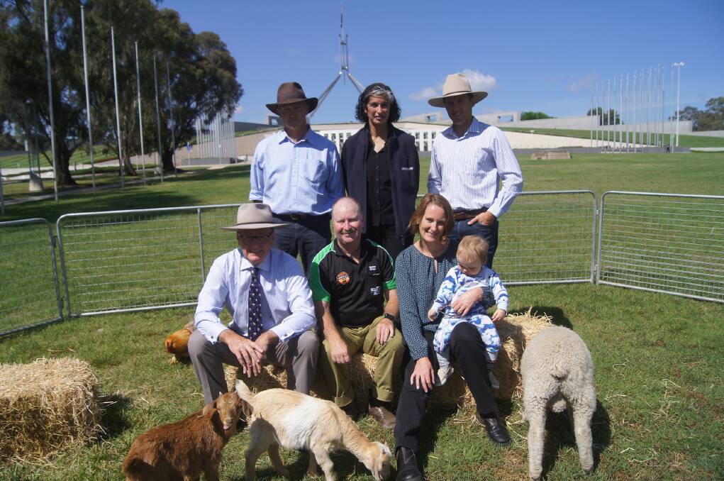 Farmers for Climate Action in Canberra. Beef cattle farmer Glenn Morris, of Inverell in NSW (back left); Dairy farmer Karrinjeet Singh-Mahil, of Crossley in Victoria; Liverpool Plains beef cattle farmer Derek Blomfield; Peter Holding, a mixed crop and sheep farmer from Harden in NSW (front left); dairy farmer Greg Dennis, of Beaudesert in Queensland; and merino wool and grains farmer Christie Kingston of Goomalling in WA and baby Robbie Rose.