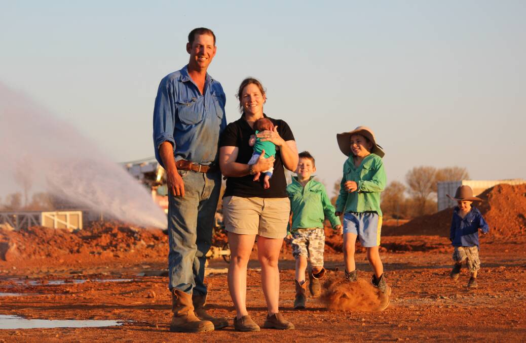 BIG RELIEF: Running completely dry and destocking the remaining 2300-head of cattle was not an option at Canoway Downs, managed by Gerard and Jodie Tully, with kids Archie, Oscar, Timothy and Sam. Picture: ANDREA CROTHERS.