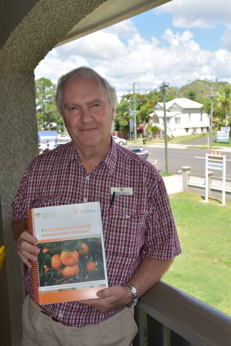 NEW BOOK: NSW DPI's Graeme Sanderson with a hard copy of the newly released Mandarin Production Manual.