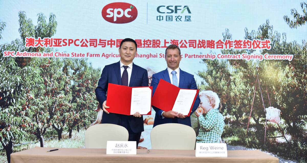 DONE DEAL: China State Farm Holdings Shanghai Corp general manager, Zhao Qingyong, and SPC managing director, Reg Weine, at the signing of the partnership that will see SPC products enter the Chinese market.