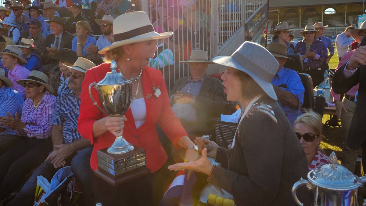 RNA steward Liz Allen and Wendy Ferguson delight over the Santa Gertrudis win in the Champion of Champions competition. 