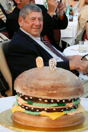 Jim Delligatti behind a Big Mac birthday cake at his 90th birthday party.  Photo: Gene J. Puskar