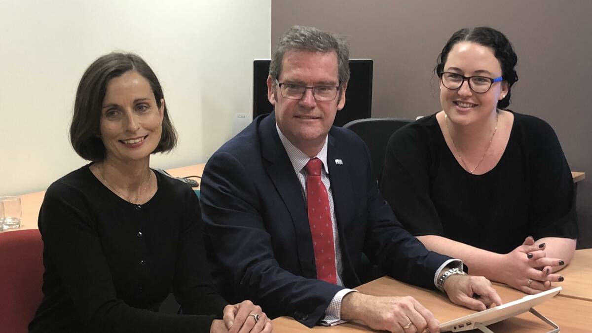 Inland Rail regional liaison officers Kathryn Cockerill and Bec Kuhn with Minister for Regional Development, Territories and Local Government John McVeigh (centre).