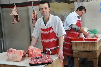 Daryl Nairn, manager and owner of Condo Quality Meats, with apprentice butcher Des Barwick.