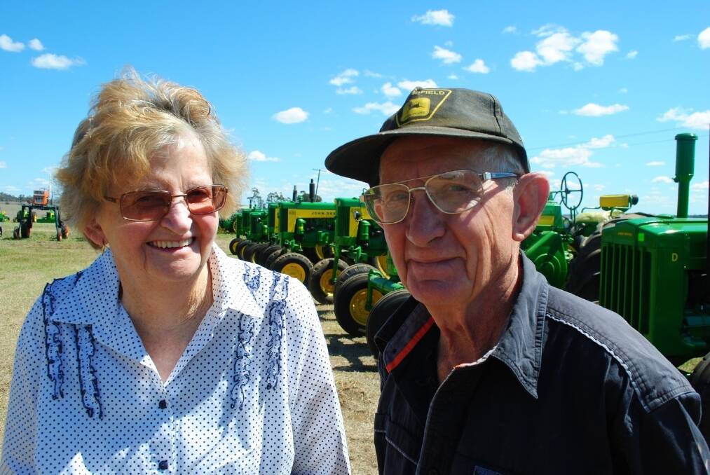 Betty and Trevor Muller with some of the more than 50 tractors that will be auctioned on their Toowoomba farm on Saturday.