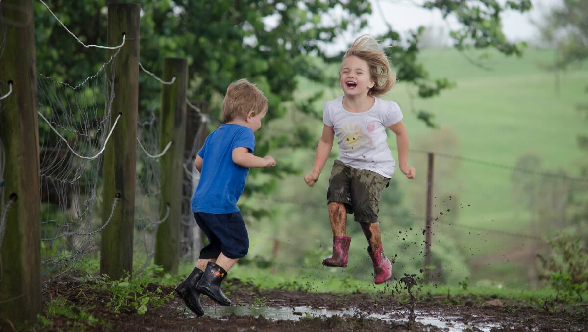 Matthew and Grace Wilson playing in the rarely-seen mud. 