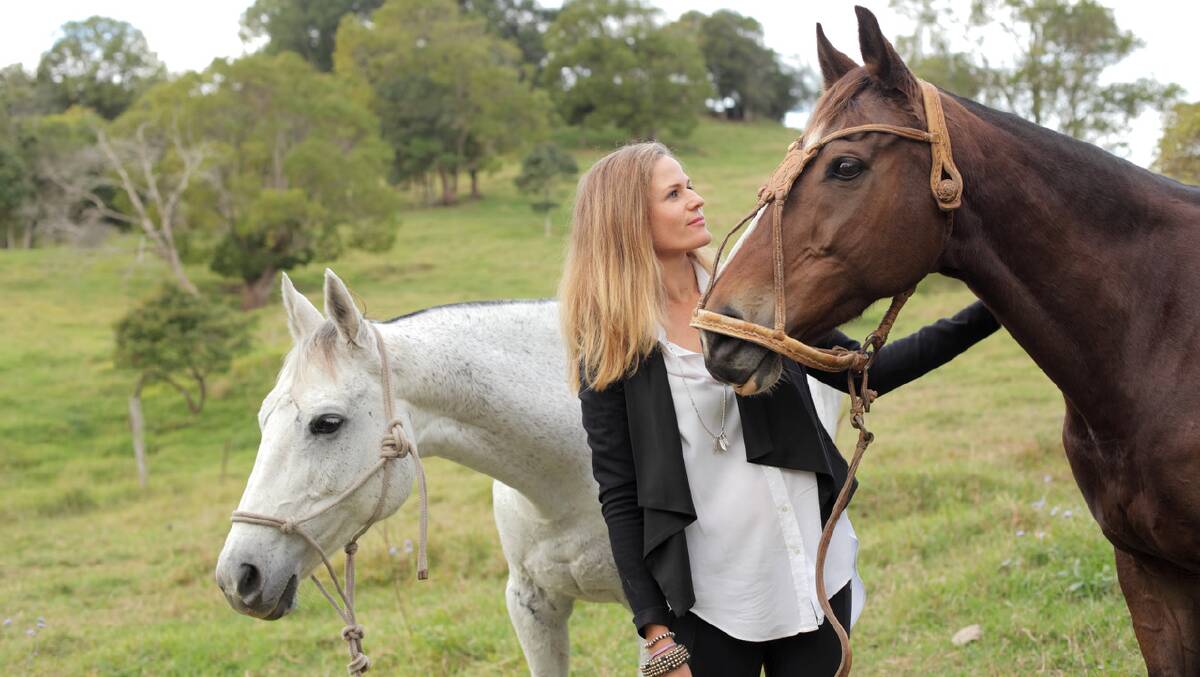 Kate at home with her horses. 