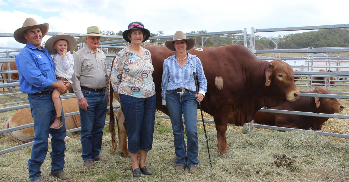 Vendor David Smith and son Mac, Vale View Droughtmasters,  Lindsay and Lyn Philp, Lynsey Park Stud, and Colleen Smith with Vale View M Diesel (P) that sold for $18,000.