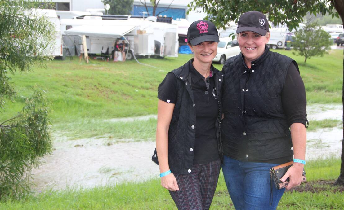 A Wet Event: Kate Dunn, Canungra, and Amanda Phillips, Canungra, travelled to compete in the horse events at the show. Photo: Melody Labinsky 