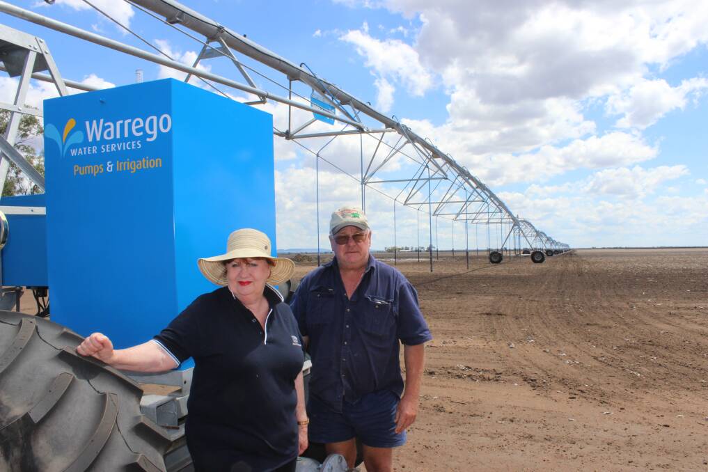 Diane and Glen Elsden apply irrigation to Tosari with their lateral irrigator.