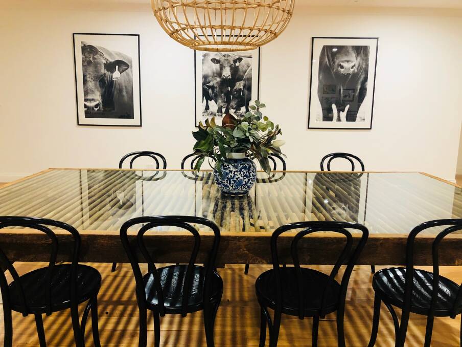 Pictures of the McDonalds' bulls adorn the dining room wall while a wool classing table straight from the shearing shed at Evergreen takes centre stage.