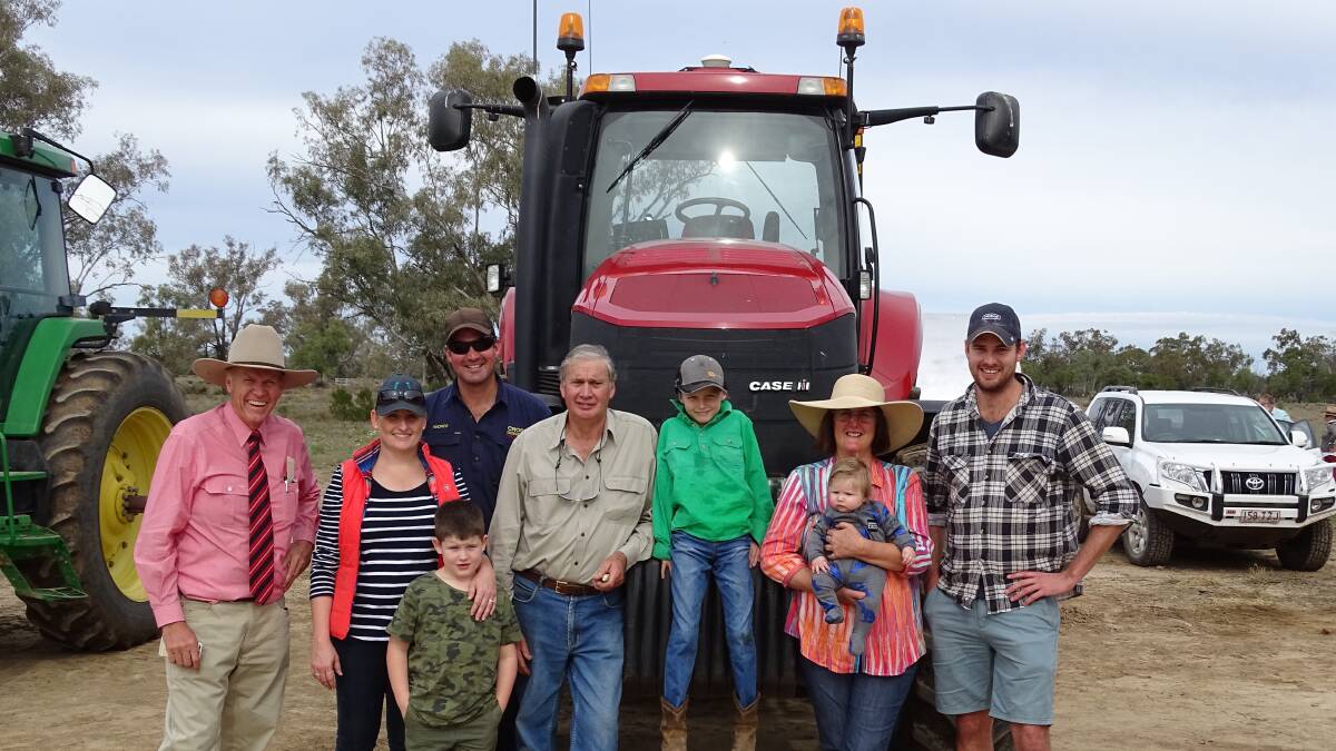 BRAEMORE CLEARING SALE: Elders auctioneer Brendan Devine, with Candice and Andrew Cross with son Bryn, Glen Cross, Harry Cross, and Margaret Cross holding grandson Sonny, and Jared Cross.