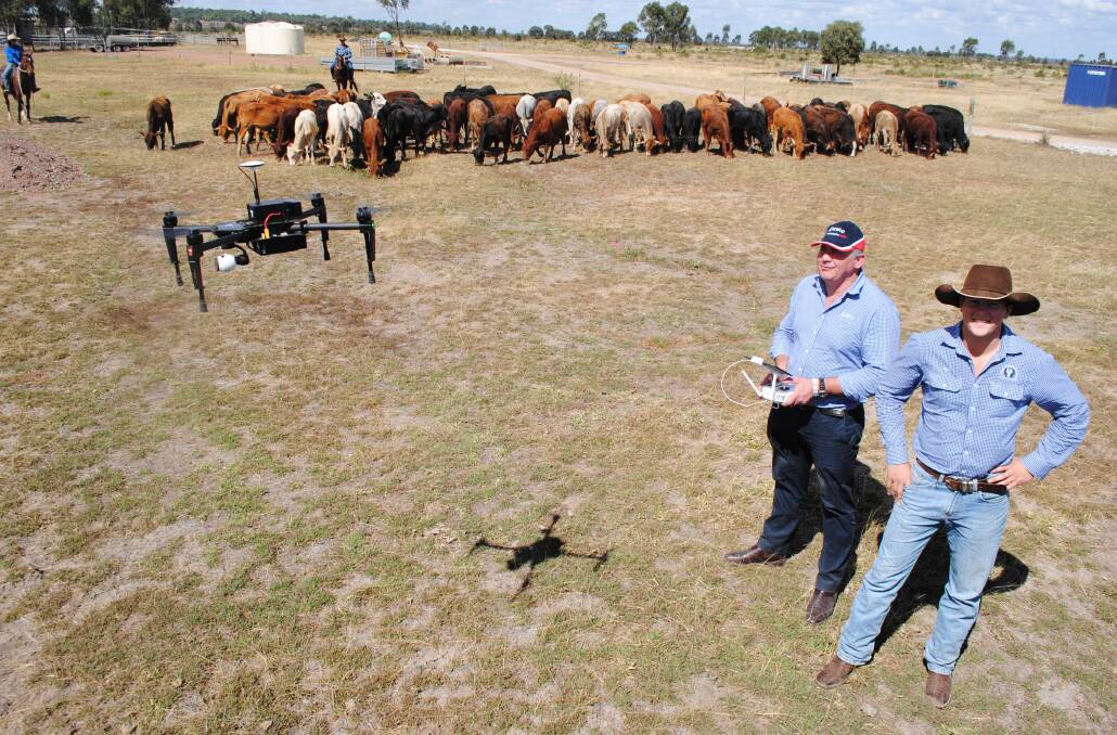 FLYING HIGH: Ruralco drone specialist Sam Hunt with Harry Phillips from Savage, Barker and Backhouse, Mackay, with a high level DJI Matrice 100 drone in use on Stephen Bella and Jill Rae's Nebo property Boothulla. 