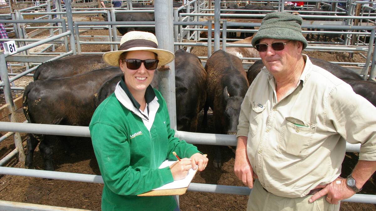 Peter Seivers, Barfold, with daughter Pam of Landmark, was a happy seller of Angus heifers ($1360) at Kyneton 