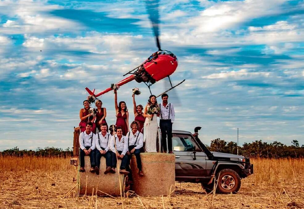 RED CHOPPER: This outback bride soared into her wedding last weekend. Picture: Maryanne Lewis. 