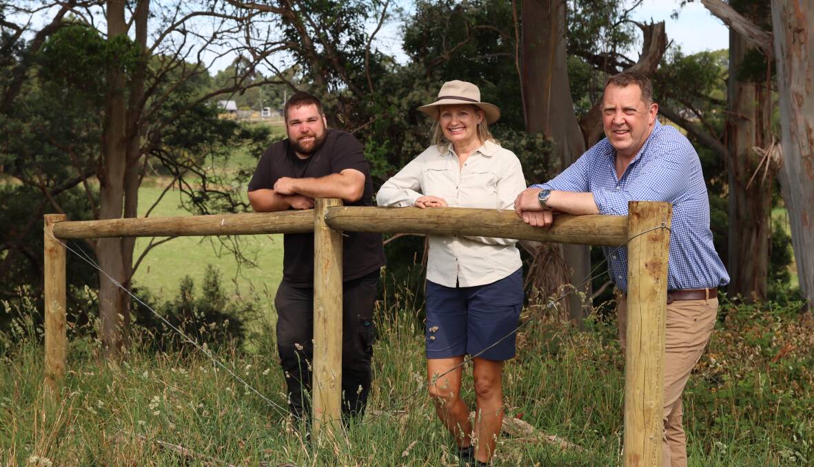 Fences: Flowerdale farmer Simon Elphinstone next to Environmental Minister Sussan Ley and Braddon Liberal MHR Gavin Pearce. Photo by Molly Appleton.