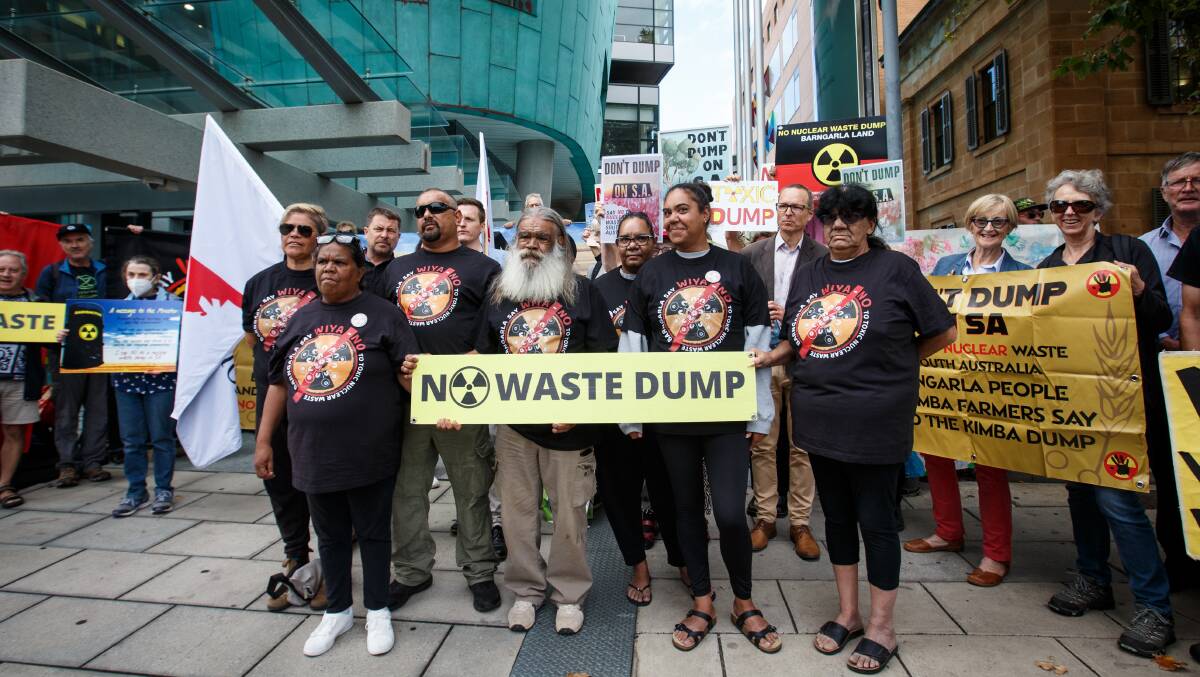 Barngarla traditional owners, Sonja Dare, Linda Dare, Jason Bilney, Harry, Coinelia, Dawneen and Dawn Dare participate in a protest nuclear waste outside the Federal Court. Picture AAP 