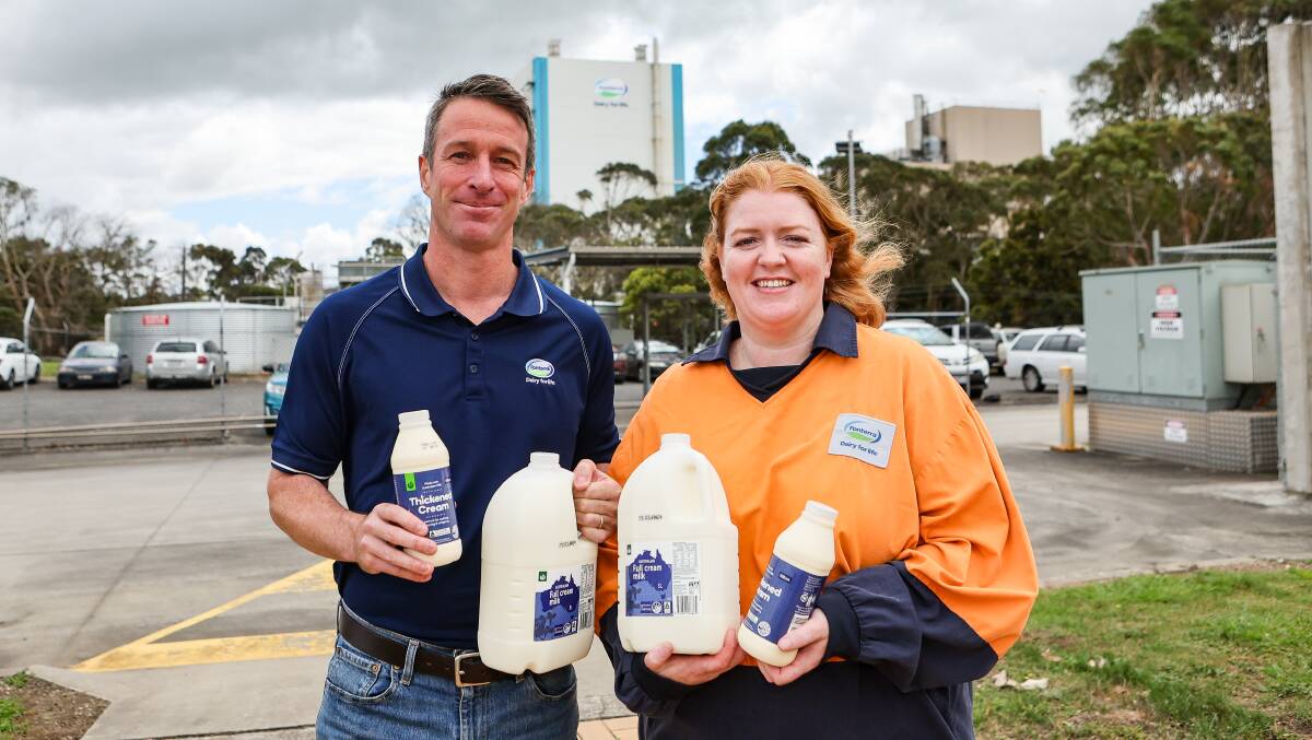 Cobden Fonterra site manager Nick Hayes and beverages production manager Caitlin Rand with the new recyclable-friendly milk bottle lids. Picture by Anthony Brady