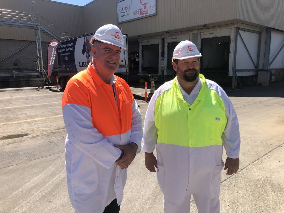 VACCINATION EFFORTS: Agriculture Minister Mark Furner (left) has praised JBS Foods for its proactive approach to staff vaccination against coronavirus. Pictured with JBS plant manager Justin McCormick. Photo: Supplied. 