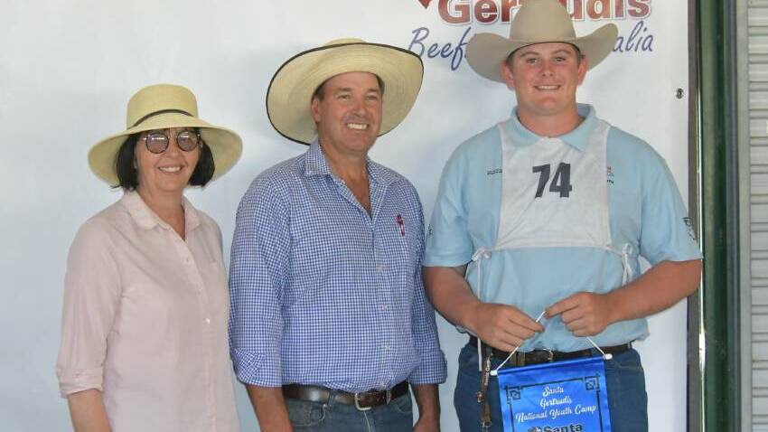 Alex Wilson, Boonah, (right), with Angela and Andrew Doering, Spring Creek Santa Gertrudis, Moree, who donated the heifer to Alex when he won Champion Santa Gertrudis herdsperson. Picture: Brett Tindal.