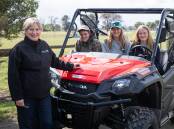 GROWING DEMAND: Training and Skills Minister Gayle Tierney along with South West TAFE students in a new quad bike as part of new equipment purchased for new agriculture courses at South West TAFE in Colac.
