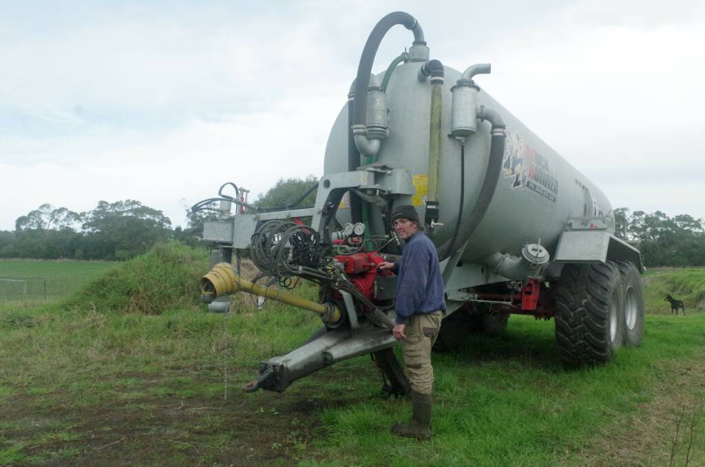 Peter Young uses a slurry cart to distribute effluent on his paddocks at his dairy farm at Buffalo, Vic. Picture by Jeanette Severs 