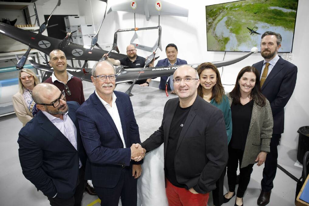 Hitachi Vantara senior director Owen Keates announcing a new partnership with Carbonix founder Dario Valenza. Picture supplied