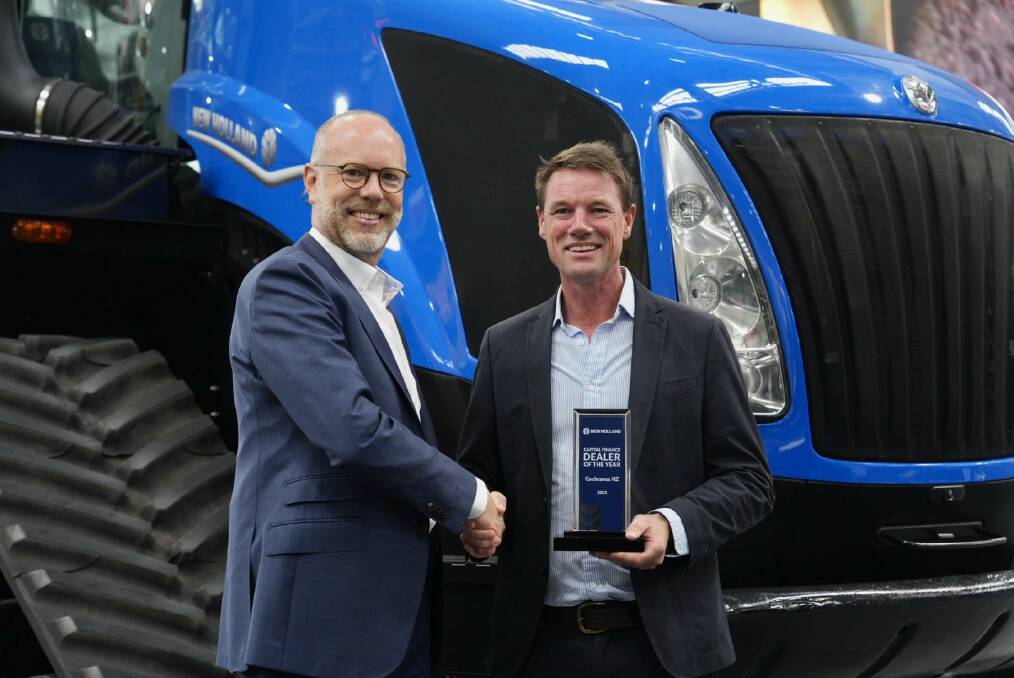 CNH Capital managing director for ANZ Matt Dowling congratulating Cochranes of Canterbury dealer principal Chris West on receiving the New Holland CNH Capital Dealer of the Year award. Picture supplied