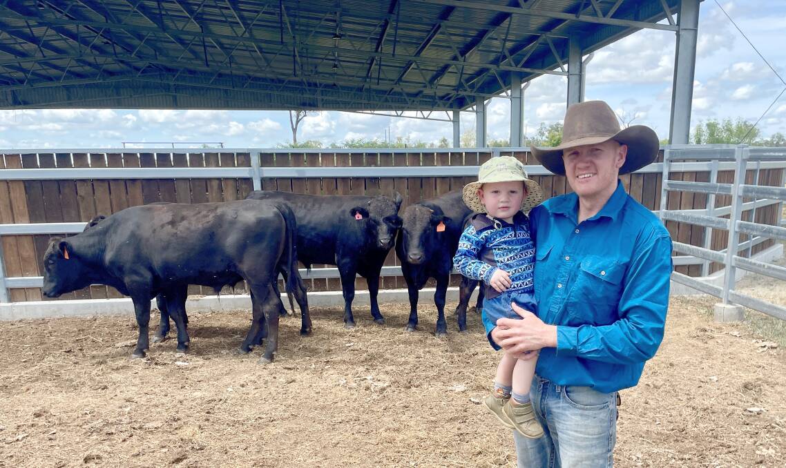 James Parker and his two-year-old son, Archie, with some their Wagyus. Picture: Judith Maizey